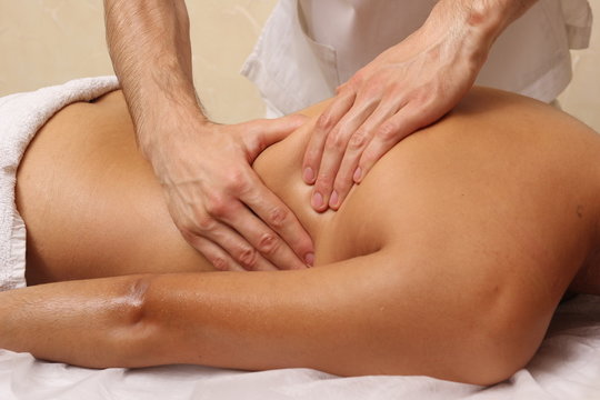 Back massage in the spa salon.