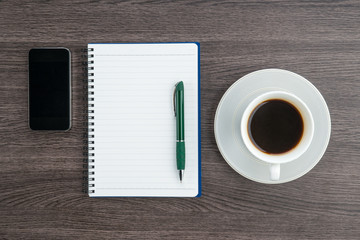 notebook, pen and Smartphone with cup of coffee