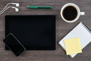 Tablet, headphone, notebook and smart phone with coffee
