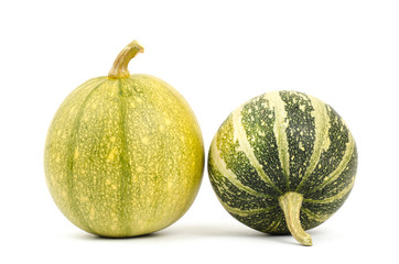 Raw pumpkins on white background