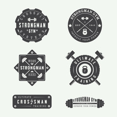 Set of gym logos, labels and slogans in vintage style