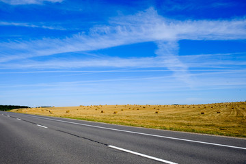 Fototapeta na wymiar Empty road bluse sky coutryside landscape