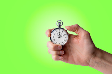 timer hold in hand, button pressed, green background