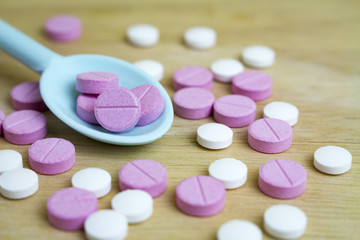 group of drugs on a spoon and wooden board