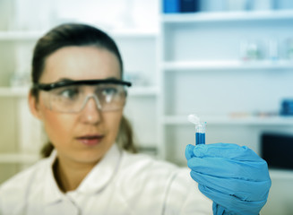 female researcher with equipment in the lab