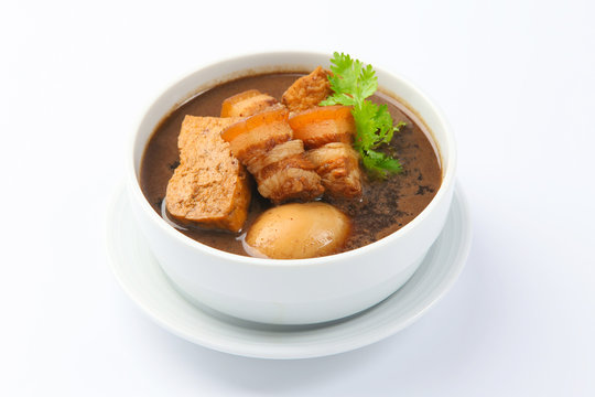 Eggs and sweet pork with fried tofu,boiled in brown sauce(Thai f