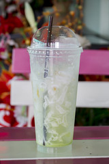 empty iced milk green tea on a table