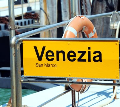 Fototapeta venice written in the ferry boat stopper in italy