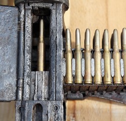 charger with many a machine-gun bullets