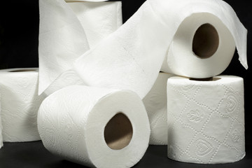 White toilet rolls isolated on black