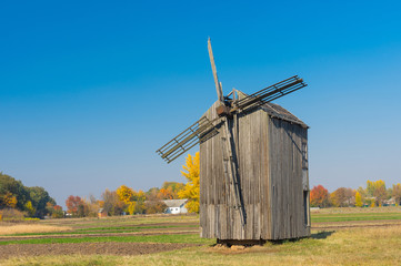Fototapeta premium Ancient wooden windmill located in Dikanka village, Ukraine