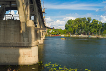 Autumnal landscape with old railroad arched bridge over Dnepr river in Dnepropetrovsk, Ukraine © Yuri Kravchenko