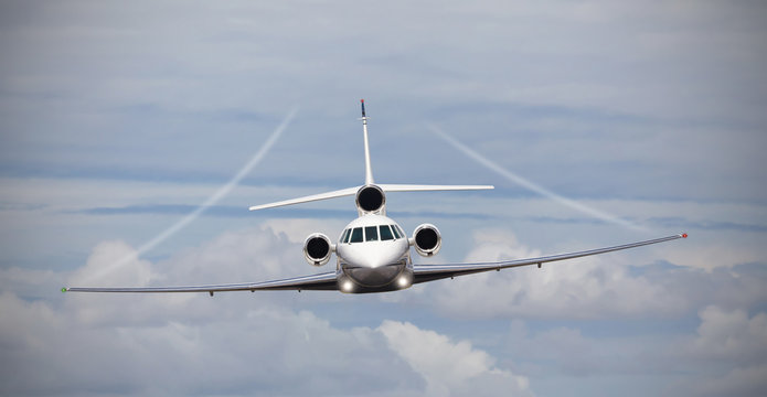 Frontal view of a private jet in midair