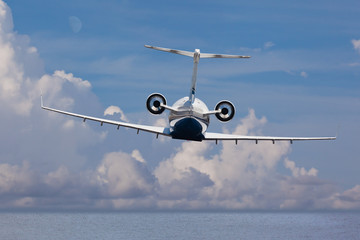 Rear view of a private jet landing