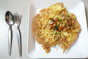 crispy omelet with shrimp and vegetable on top