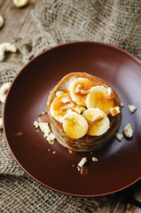 banana cashew pancakes with bananas and salted caramel sauce