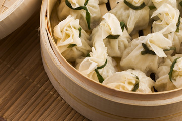 Chinese dumplings in bamboo steamers