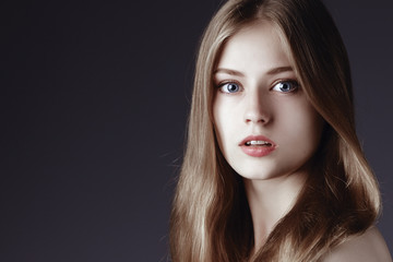 Fototapeta premium Fashion portrait of elegant woman with magnificent hair. Blonde