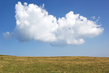 big cloud over the plain in summer day