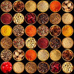 Different spices on black background