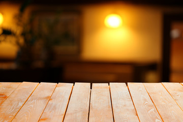 Wooden table  with abstract  blur background