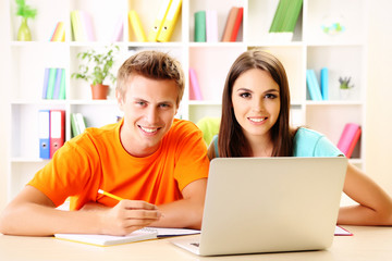Young students sitting at the library
