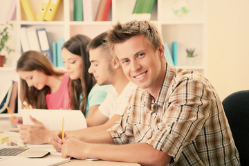 Young students sitting in classroom