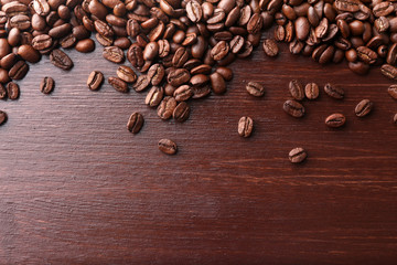 Coffee beans on wooden background