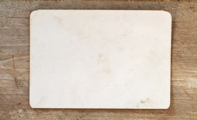 Vintage blank paper on wood background