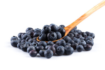 Fresh blueberries in wooden spoon