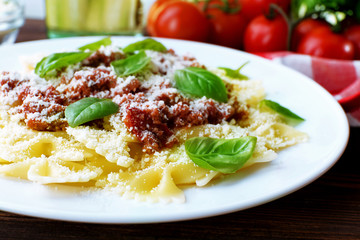 Pasta bolognese in white plate, closeup