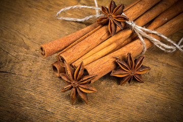 Close up of cinnamon sticks and star anise on wood
