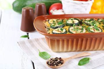 Casserole with vegetable mallow on wooden table, closeup