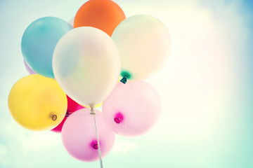 vintage colorful balloon on blue sky concept of love in summer and valentine, wedding honeymoon - soft focus effect