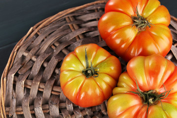 Green tomatoes on table close up