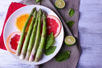 Fresh asparagus on plate, close-up