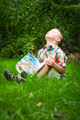 Little boy reading book