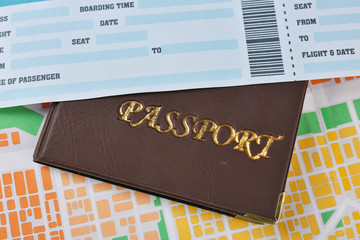 Passport with ticket on map background