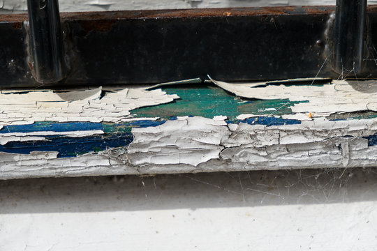 Window Sill Showing Cracked And Flaking Paint