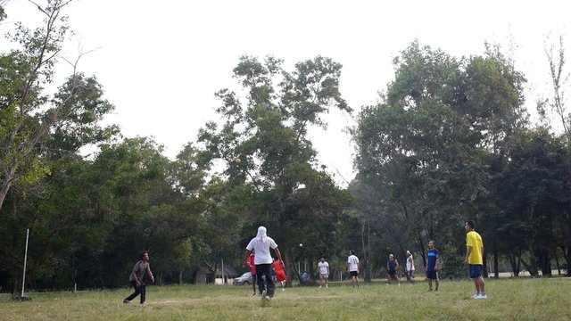 Group of People Playing Takraw or Kick Volleyball Outdoors