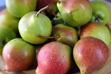 Heap of ripe tasty pears close up
