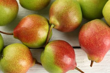 Fresh pears on wooden table, closeup