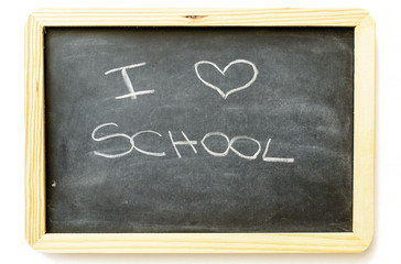 Obraz premium i love school written with chalk on blackboard