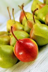 Fresh ripe pears on table close up