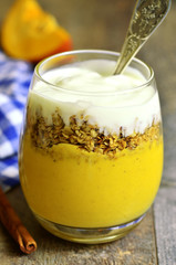 Pumpkin smoothie with granola and yogurt.
