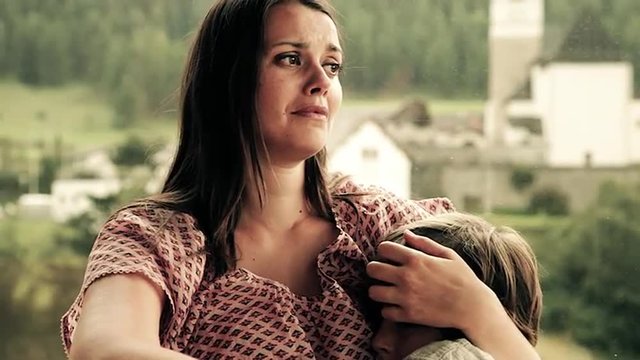 Woman holding sad boy crying together closeup