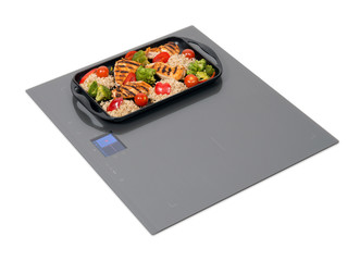 Gray induction hob with touch control panel isolated on white.