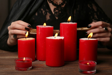 Witch - fortune teller with candles close up