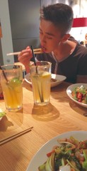 boy eating in an asian restaurant
