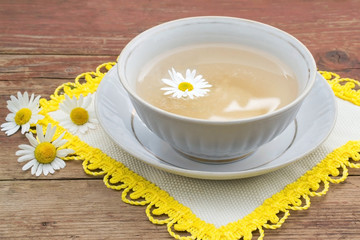 Herbal medicine: curative tea with chamomile